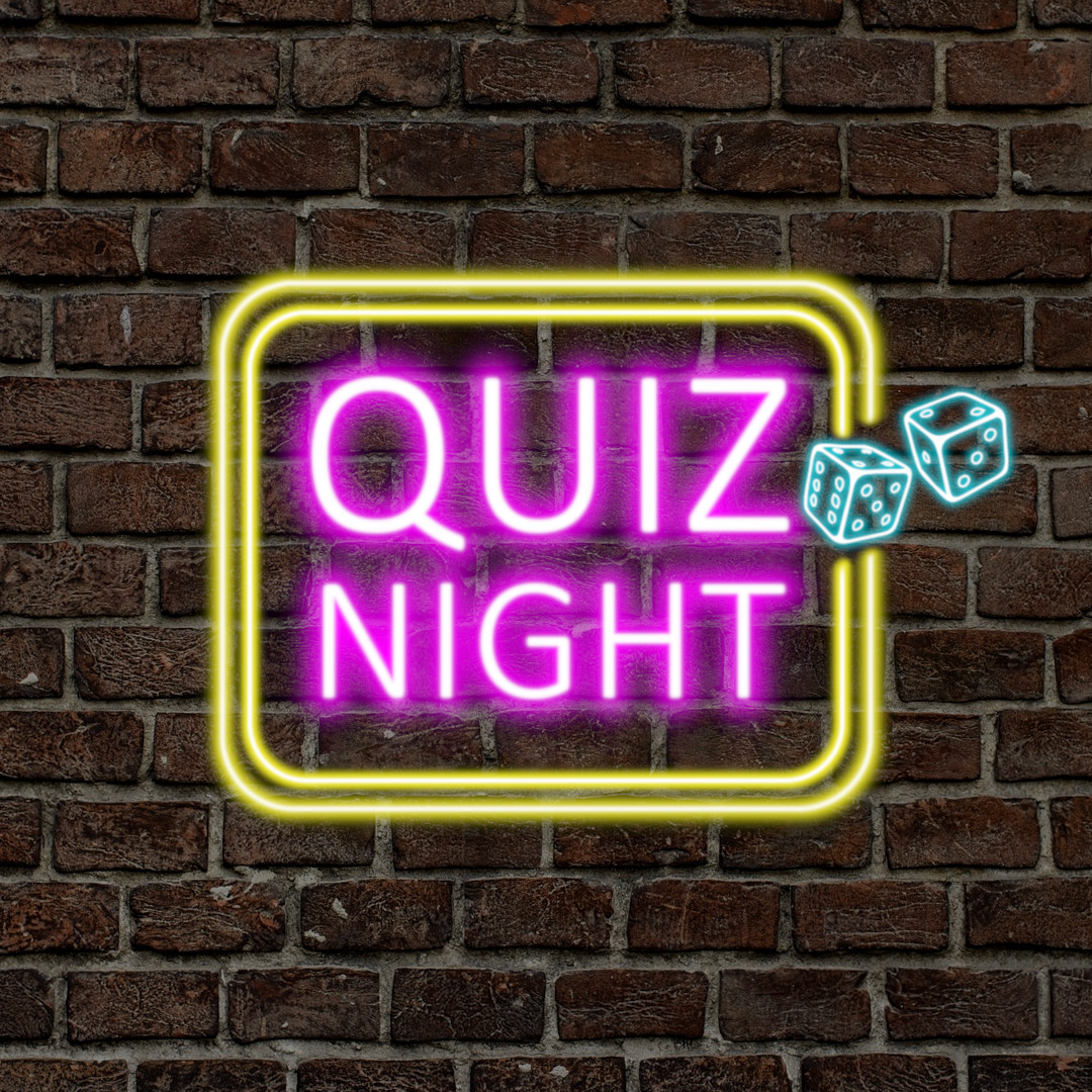 Ein Neon Schild mit der Schrift "Quiz-Night" an einer Backsteinmauer